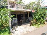 Tanah plus Rumah dua lantai pinggir jalan raya